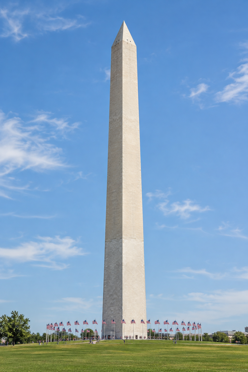 The full Washington Monument rising above a circle of American flags.